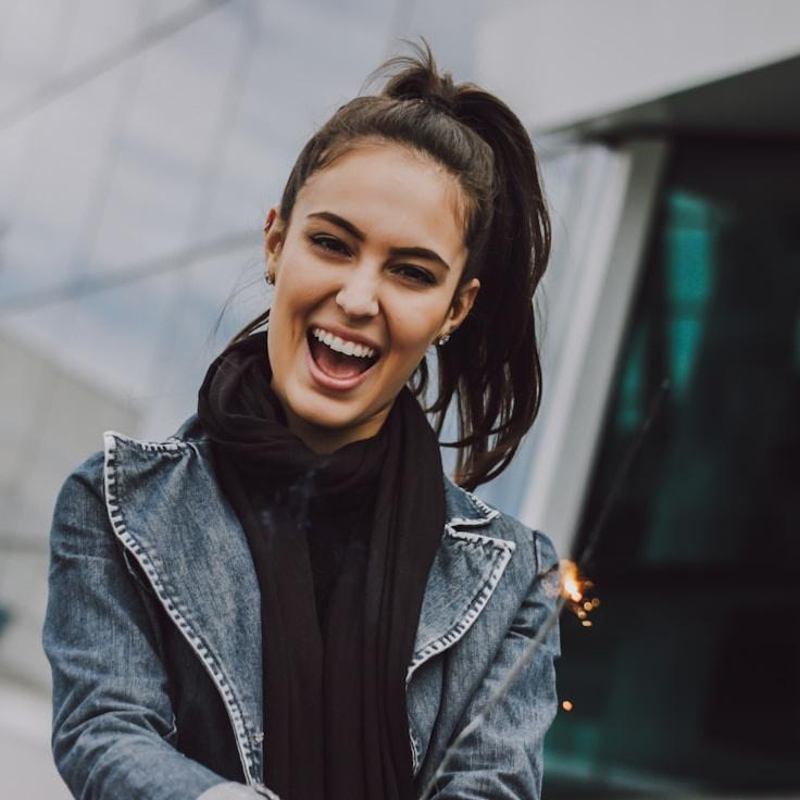 A former hospitality manager turned design lead reviewing corporate floral arrangements